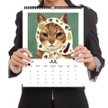 Calendrier mural 2026 avec autoportraits de chats - 12 modèles uniques